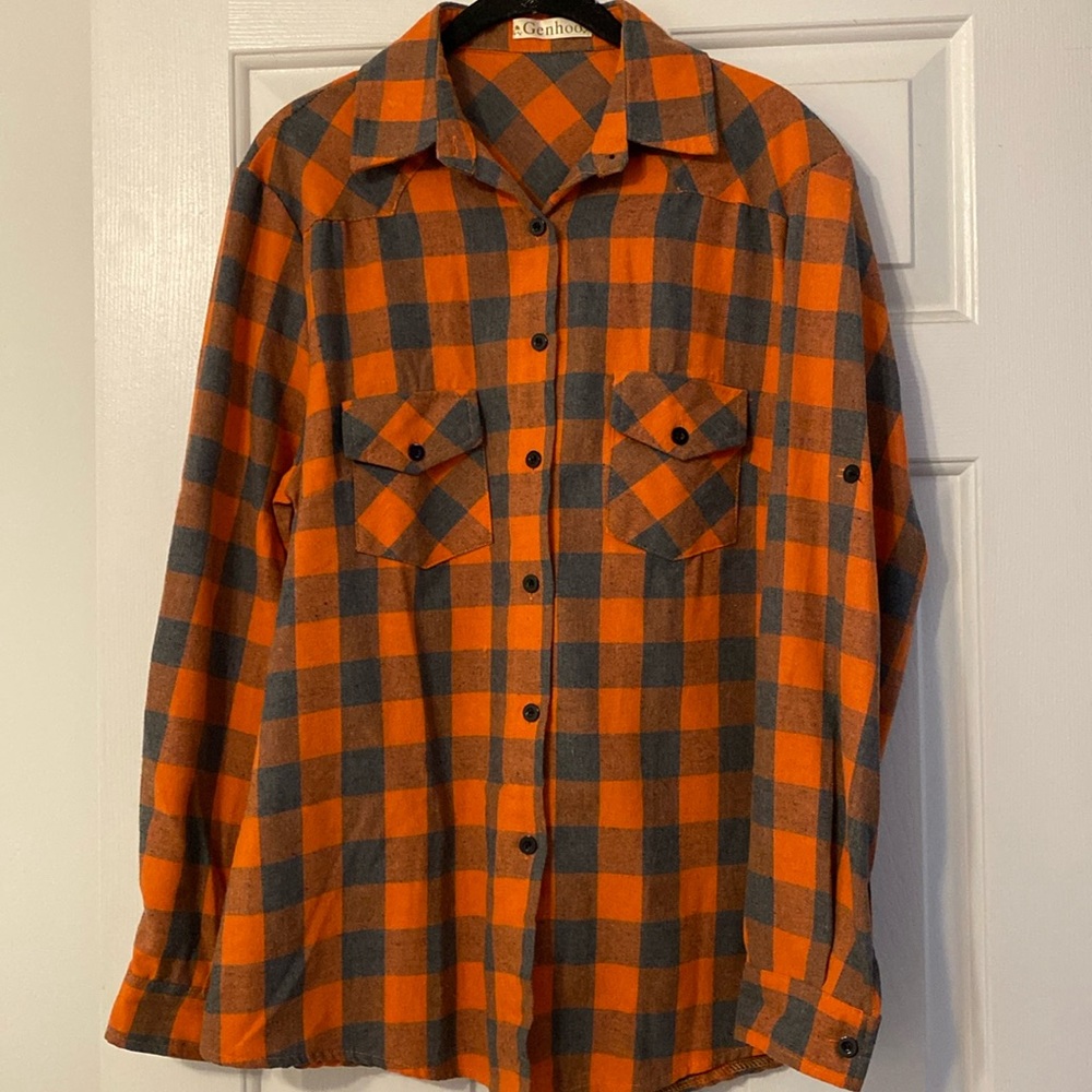 Button down shirt in good condition.  Darker orange and gray